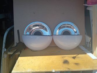 A pair of custom made wall sconces