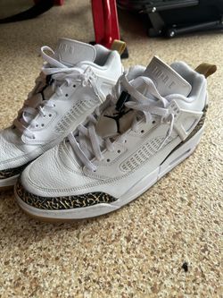 Jordan Spizike Low sneakers in white with black and gold elephant print.