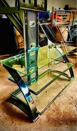 modern glass TV stand with an integrated mount. This specific model is a Z-Line Designs television s