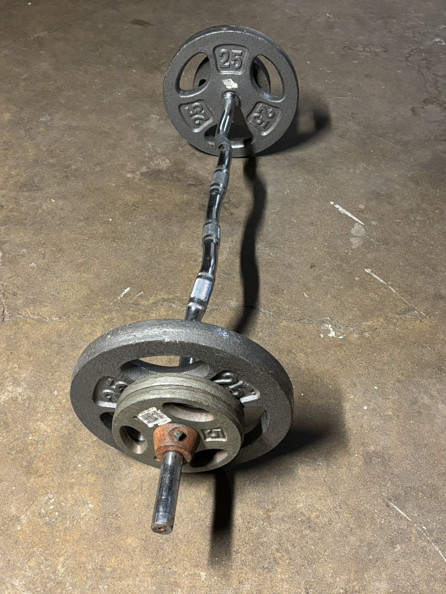 Curl Bar And Weights. Total 85 Lb Weight.