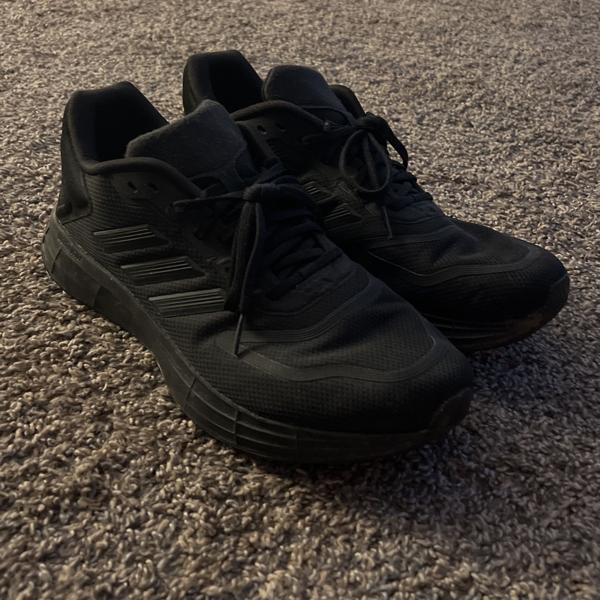 Adidas black running shoes