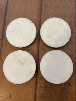 White marble coasters with copper rim