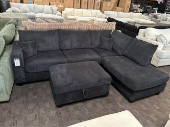 Black corduroy sectional w/ storage ottoman