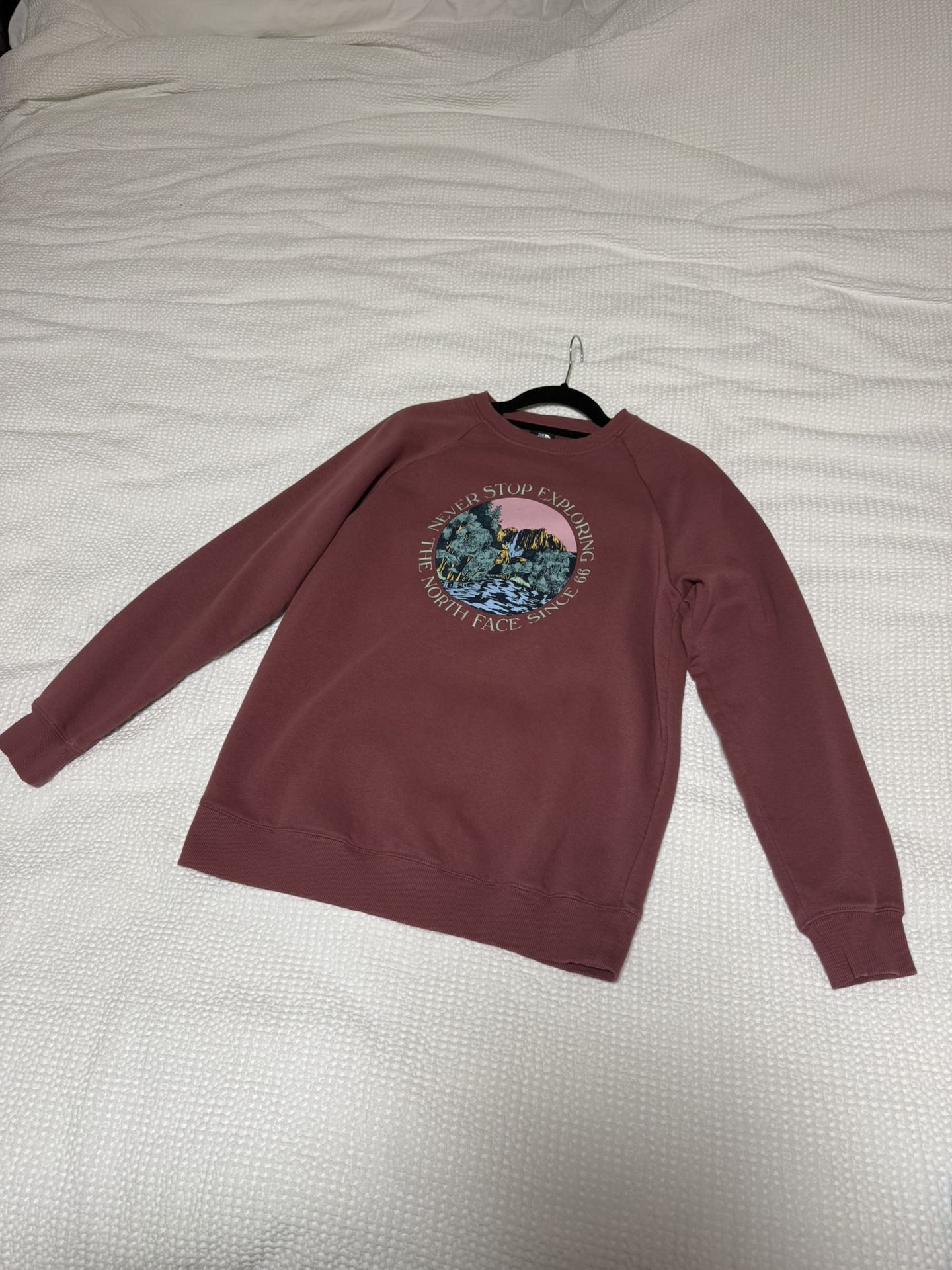 Size M Women's jacket The North Face. The North Face *Never Stop Exploring* Crewneck Sweatshirt