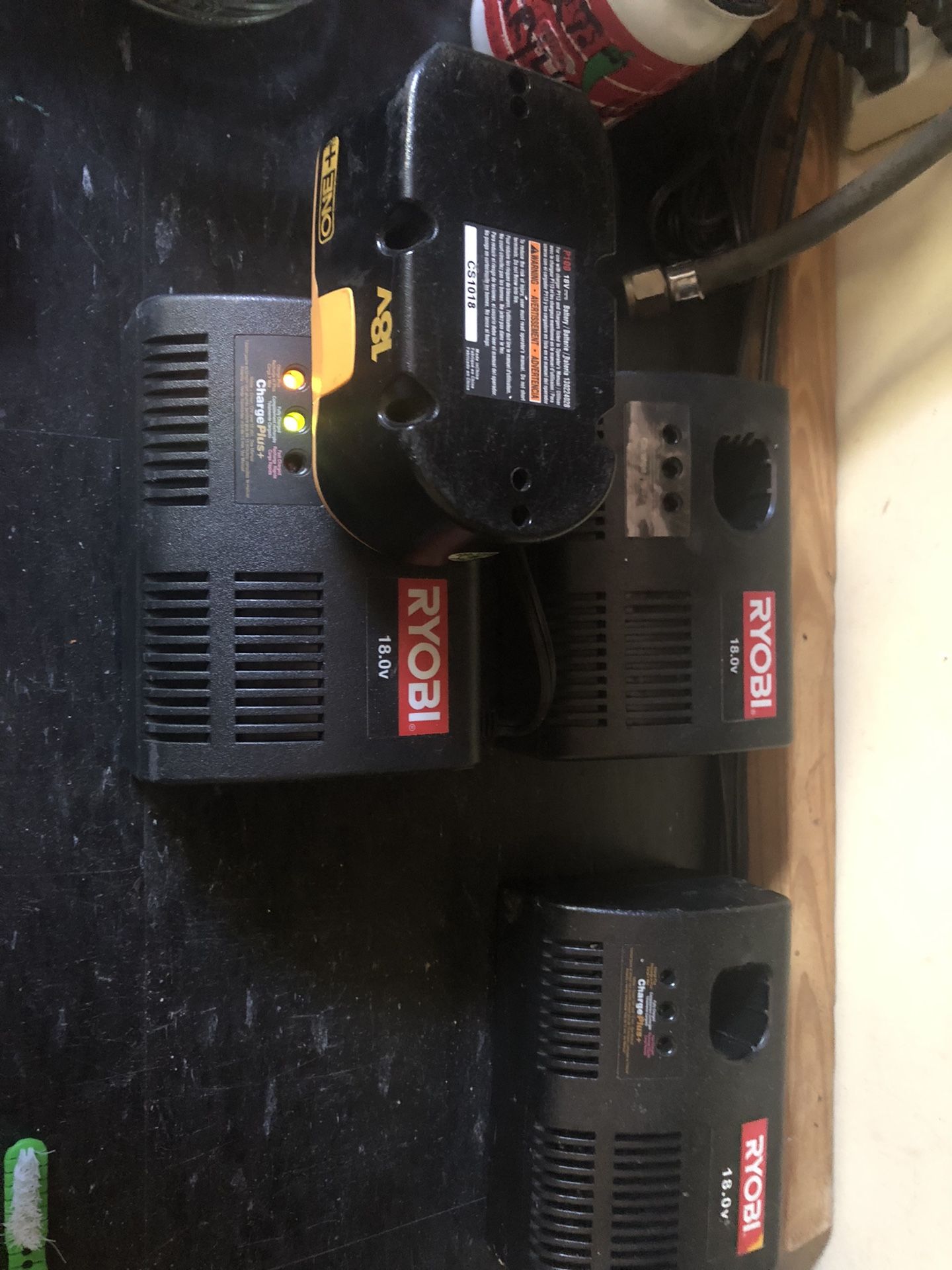 Three Ryobi Chargers And One Battery 