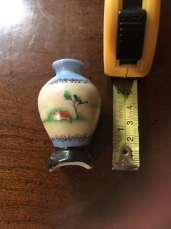 Vintage antique porcelain vase with unique picture on front