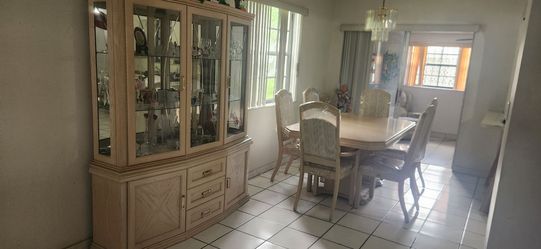 Dining room Table with Chairs and Showcase