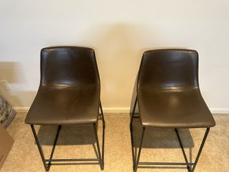 Two Leather High top Chairs 