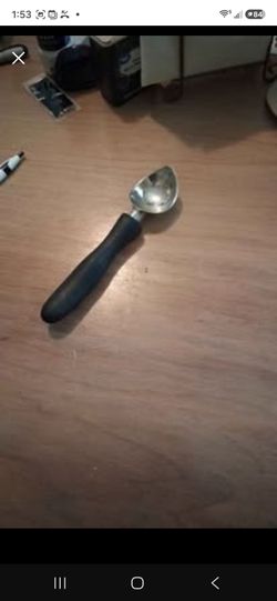 An Ice Cream Scoop and a small wooden spoon