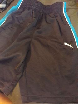Puma shorts black with blue on the sides size 6