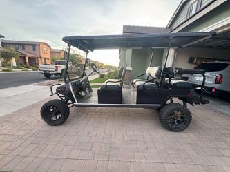 Lifted 6 seater gas golf cart