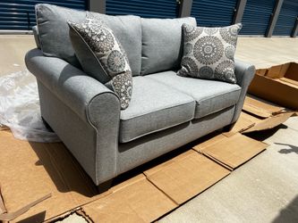 Brand New! Upholstered 64” loveseat. $449. Only 1 available.