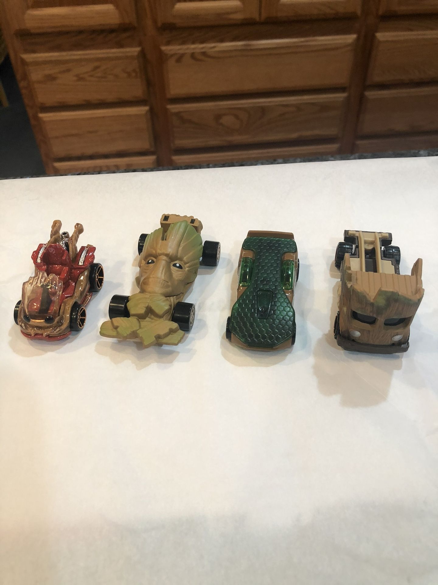 Disney Marvel Guardians of the Galaxy Groot Lot of 4 cars. One car from Marvel and Three are Hotwheels. Preowned good condition.