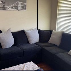 Black and brown sectional couch