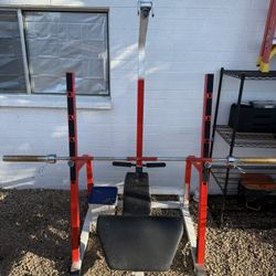 Bench Press / Squat rack with bar and 45 pound weights