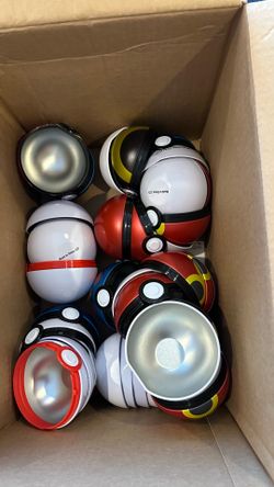 Assorted empty pokeball tins