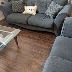 Sofa, love seat, dining room  table with chairs and glass stand.