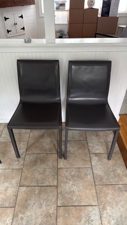 Two Charcoal Gray Leather Dining Chairs