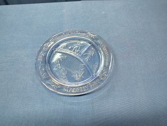 Tiara Indiana Sapphire Blue glass divided plate from the 1970s. It is a children's plate featuring the nursery rhymes "See Saw Margery Daw" and "Where