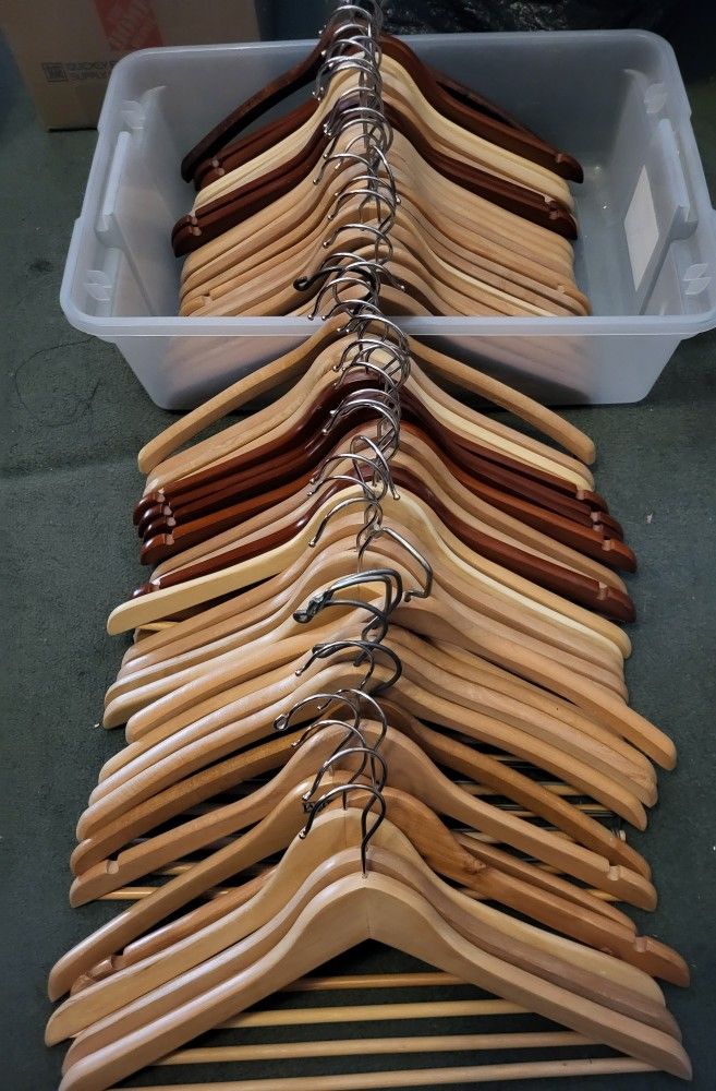About 50 Nice suit / coat hangers 