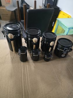 black ceramic airtight canister featuring a metal clamp lid