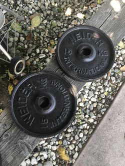 Weider International 15kg (33lbs) plates (2 inch hole) or trade for 45 lbs pairs