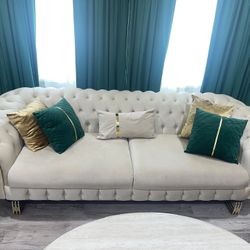 Couch With Gold Accents