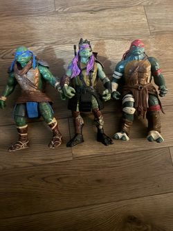 Teenage Mutant Ninja Turtles Action Figures . Raphael , Donatello , Leonardo