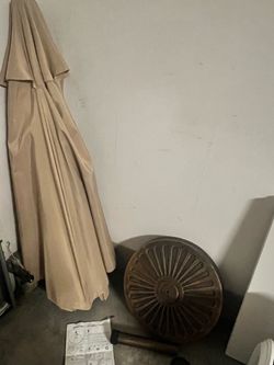 Beige Patio Umbrella with Decorative Base & Instructions — $60
