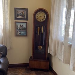Antique German Grandfather’s Clock, $200.