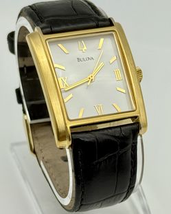 Bulova watch gold tone, 30mm size case, 7.5in size wrist leather band 