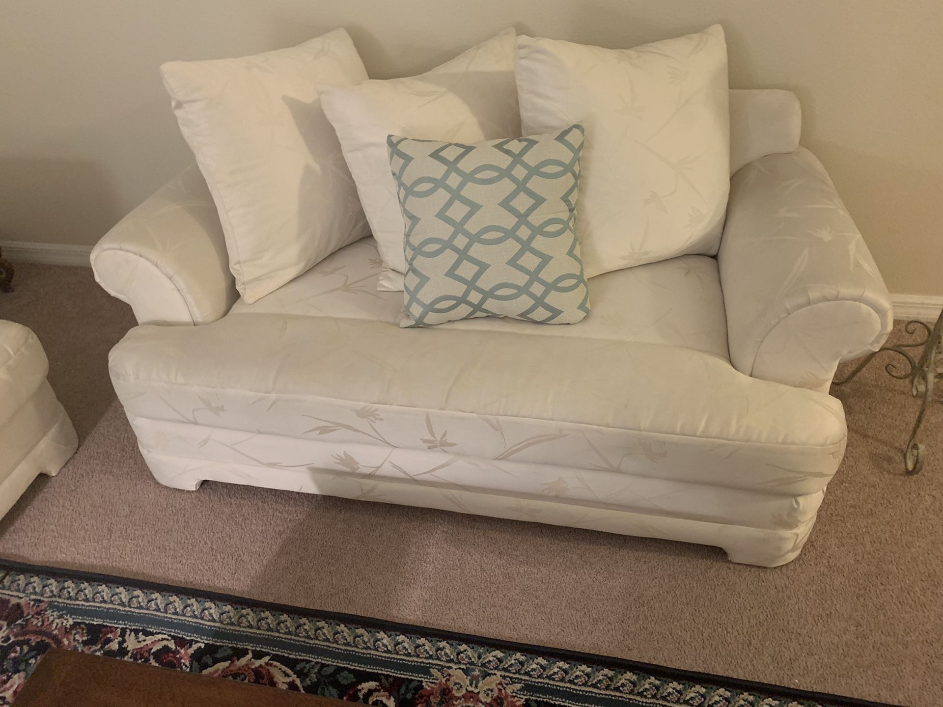 White cotton sofa and loveseat/with items