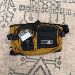 adidas Amplifier 2 Crossbody Bag in the Bronze Strata Brown/Black colorway.