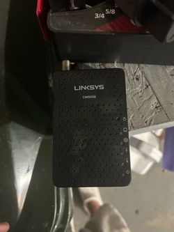 black Linksys CM3008 DOCSIS 3.0 Cable Modem featuring a vertical row of LED indicator lights on the right side