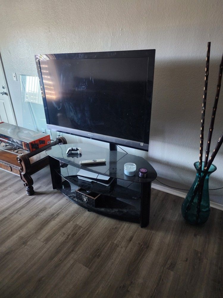 60 inch Sony Bravia TV with the entertainment stand