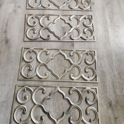 Four Decorative Metal Grates