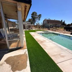 Fake grass rocks concrete