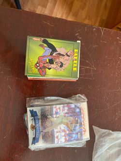 Baseball, Football, and Spider-Man trading cards.