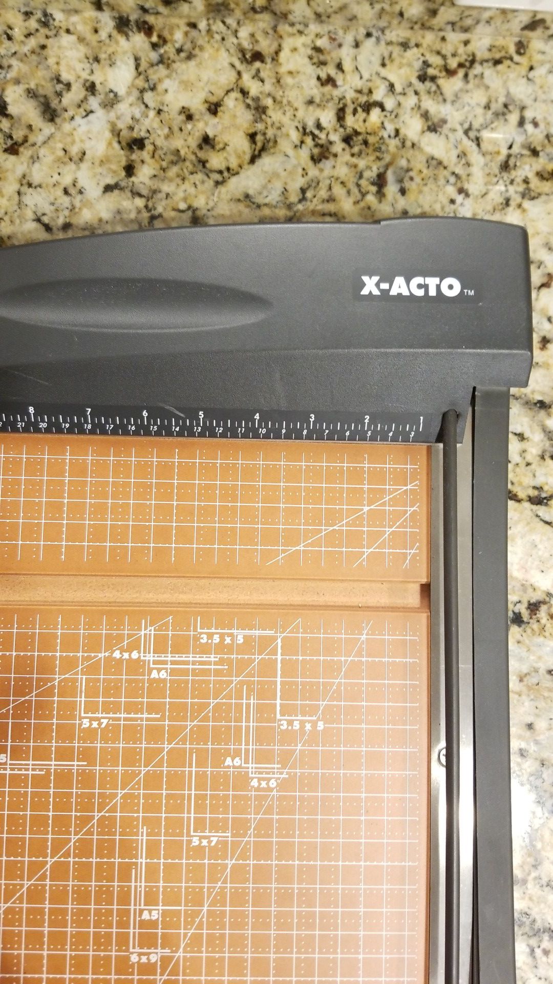 X- acto paper cutter