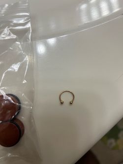 Gold Horseshoe Septum Piercing
