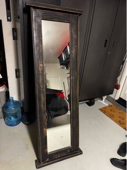 Rustic mirror with hidden compartment.