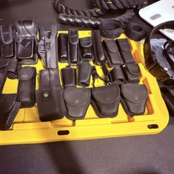 Lot of police security duty belt gear, baton holder, handcuff holders, belt 34” - 36” 