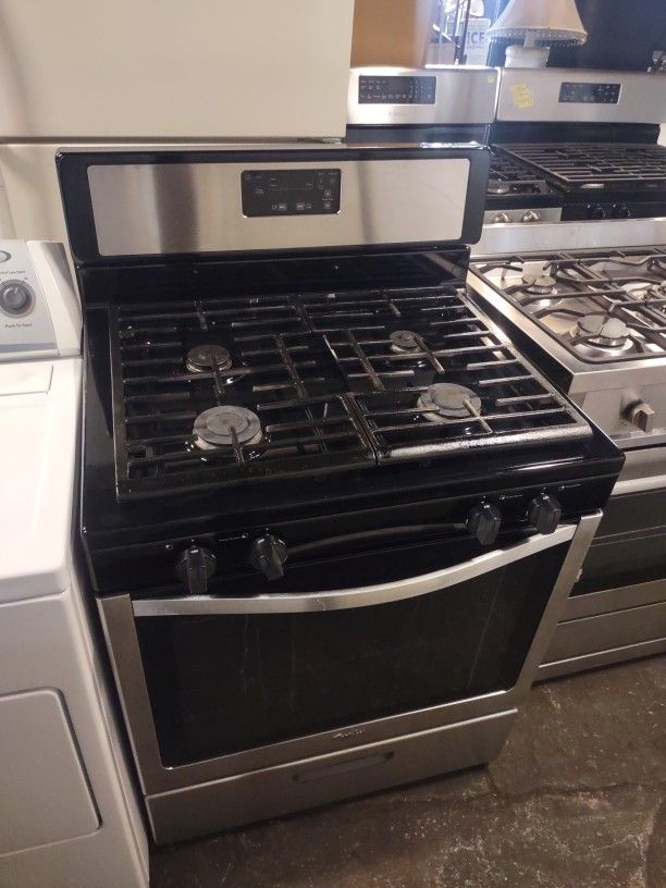 Black and Stainless Steel Four Burner Working Perfect Condition