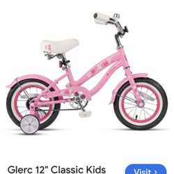 JOYSTAR Kids Cruiser Bike with training wheels, in pink with a floral design. 