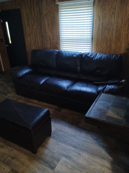 Brown Leather Couch And Ottoman, Area Rug,black Mini Fridge With Freezer, Couple More Household Items Such As Crock Pot, Conventional Oven, Etc