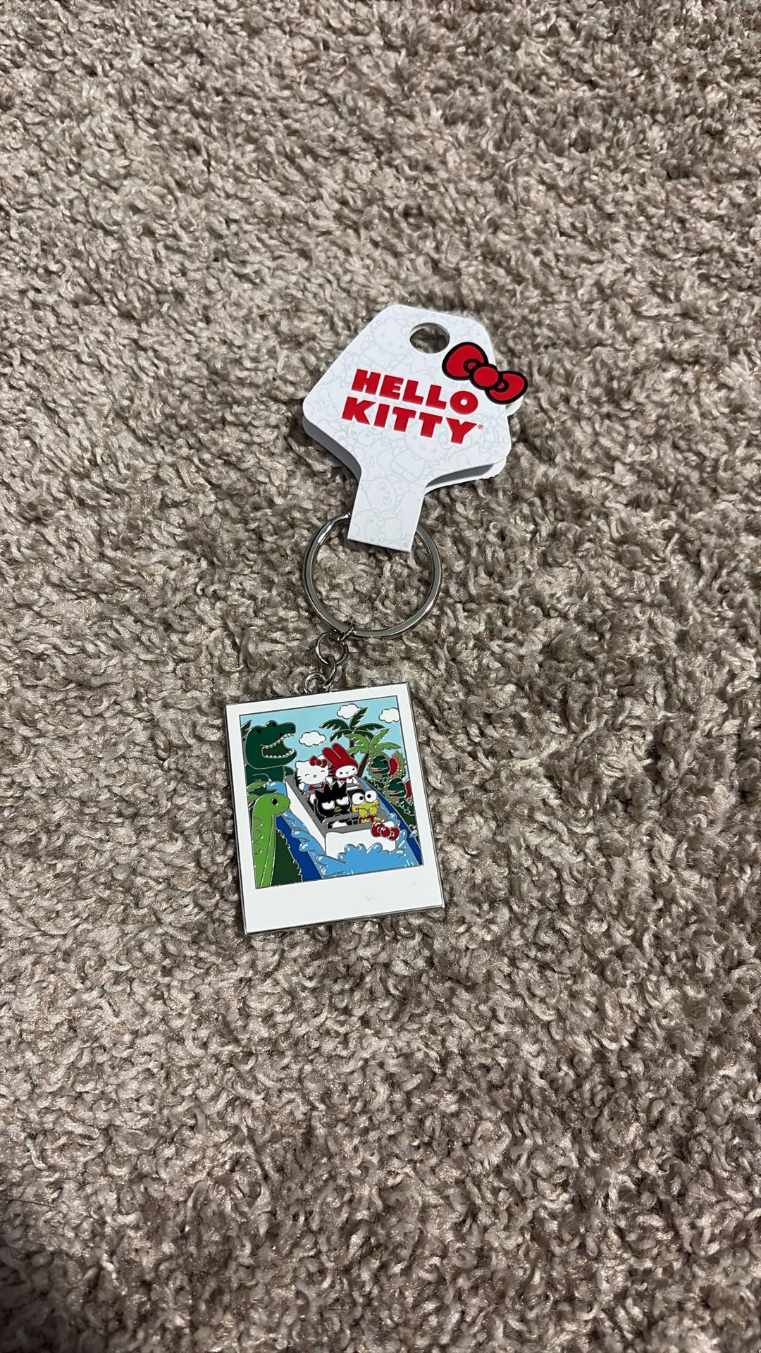 Hello Kitty Jurassic World keychain (from Universal Studios)