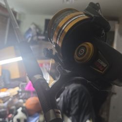 Shakespeare Ugly Stik fishing rod paired with a Penn 9500SS spinning reel