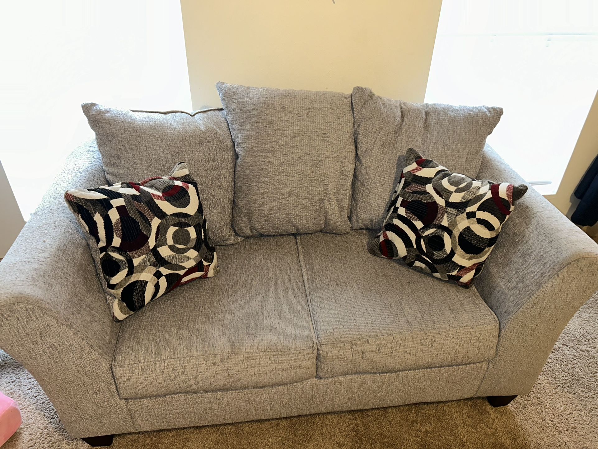 Gray Loveseat with Patterned Cushions
