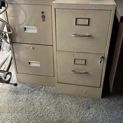 Two metal two drawer filing cabinets