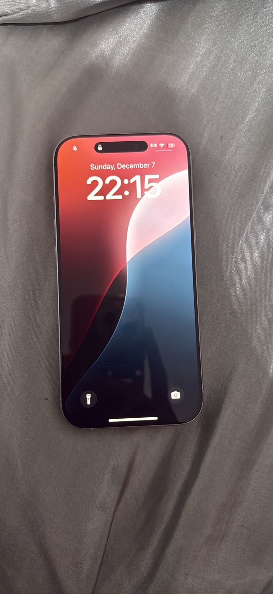 White IPhone 16 Pro with Blue Airpod Maxes